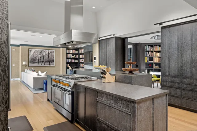 a kitchen with a stove and a refrigerator