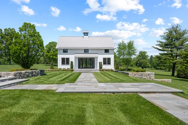 a view of a yard in front of house with a yard