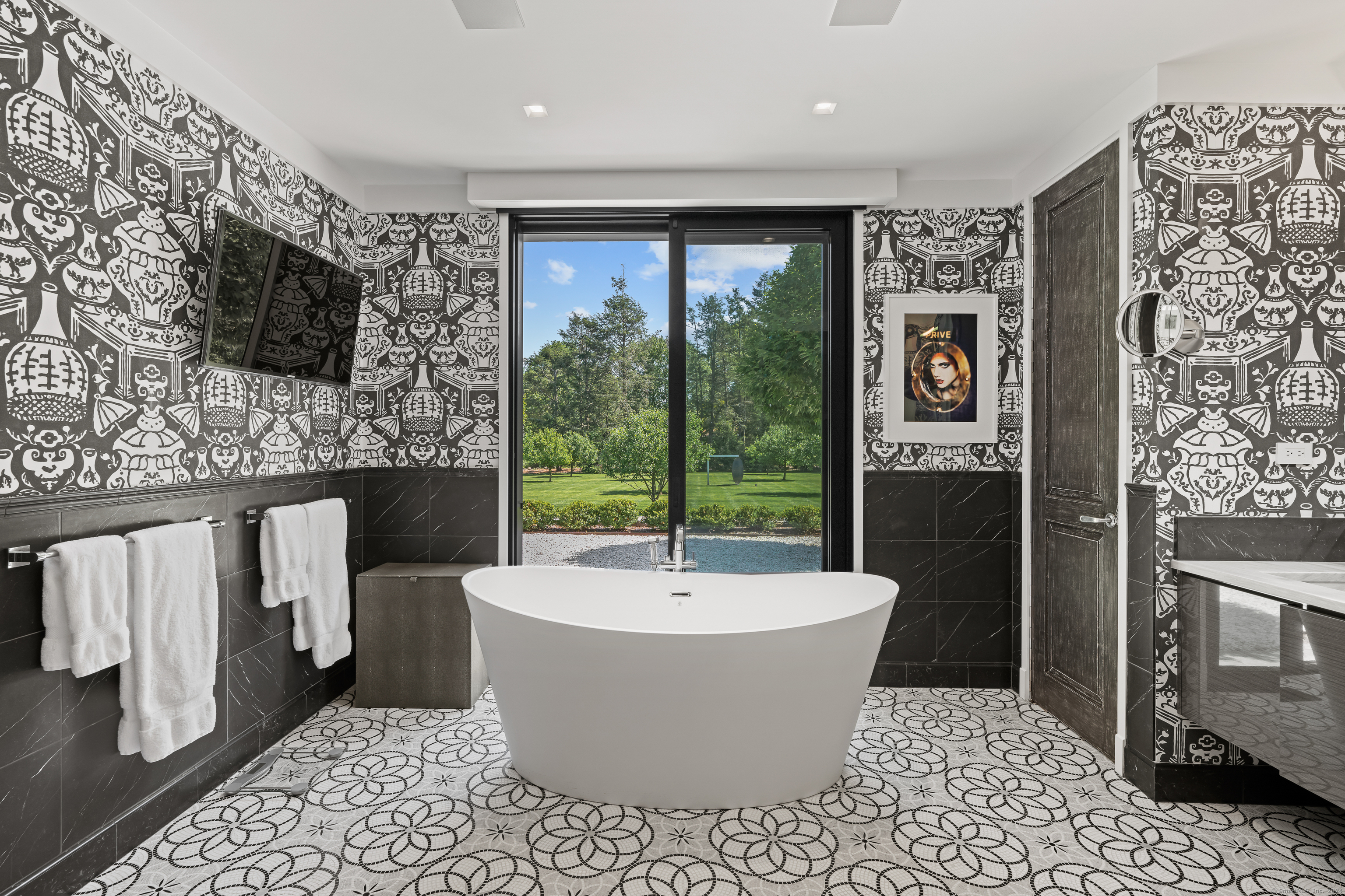 4900 Congress Street Fairfield, CT 06824 - Photo 20 of 40 a living room with furniture a flat screen tv and a fireplace