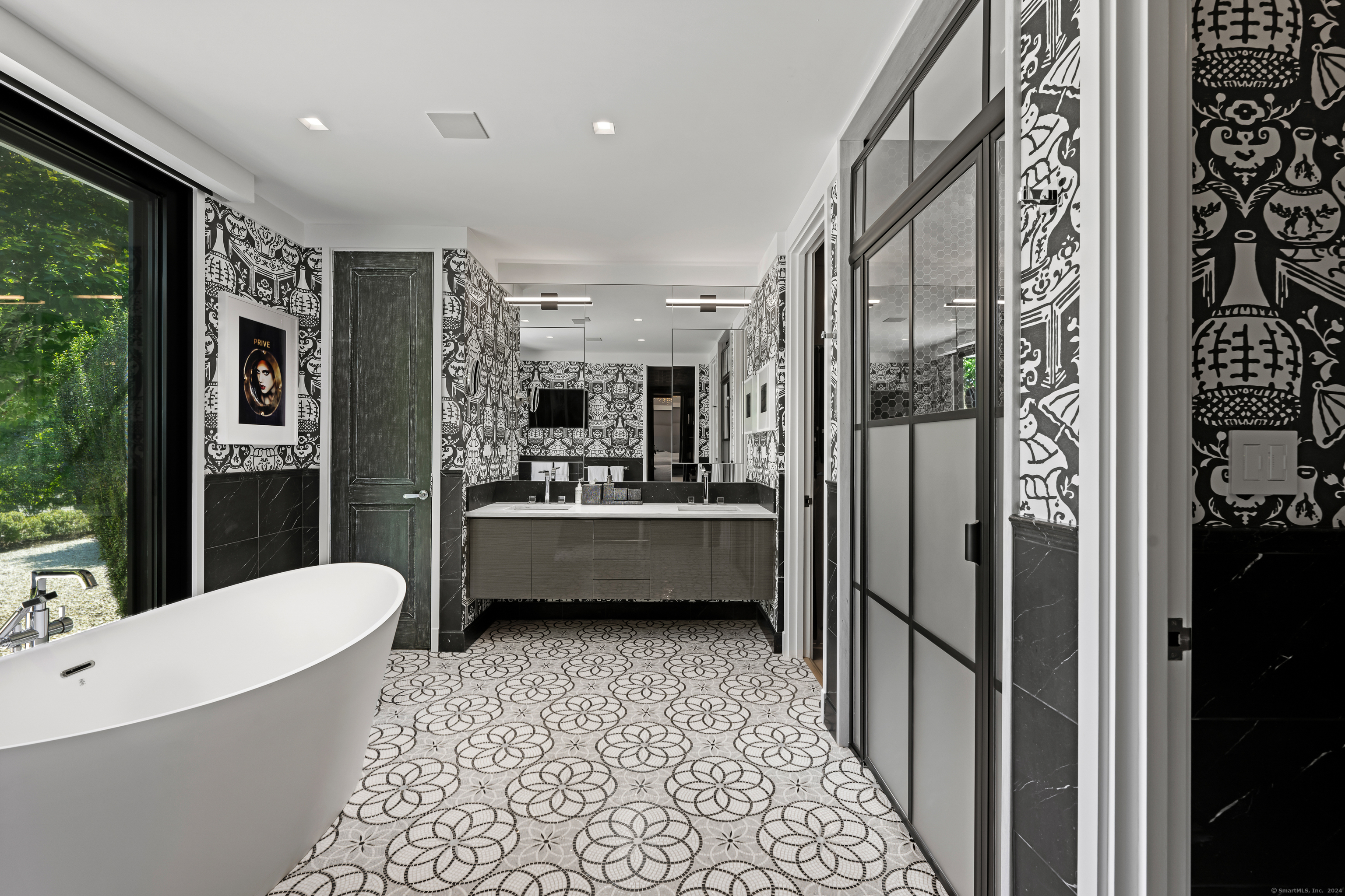 4900 Congress Street Fairfield, CT 06824 - Photo 21 of 40 a bathroom with a bathtub a mirror a shower and sink