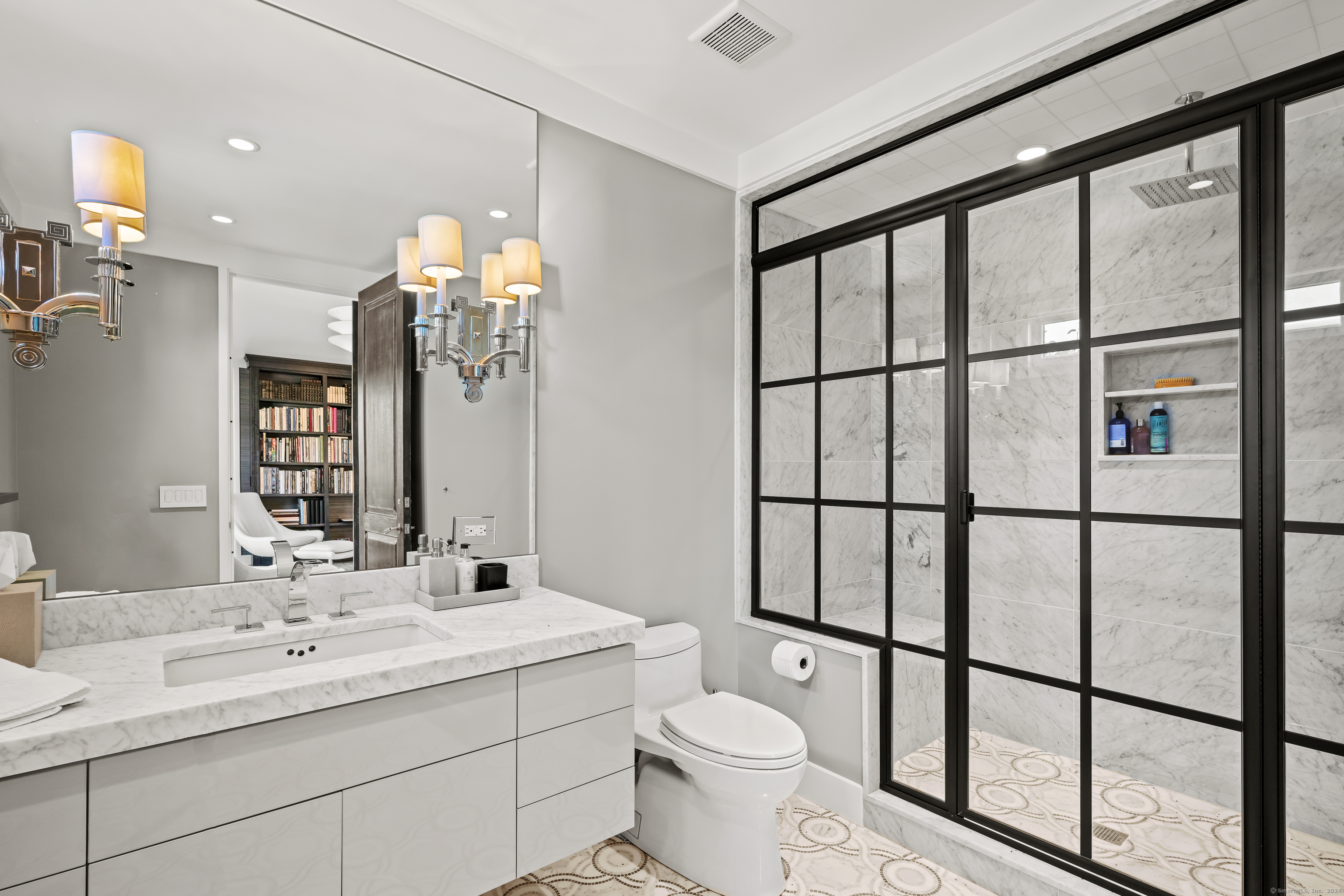 4900 Congress Street Fairfield, CT 06824 - Photo 25 of 40 a bathroom with a double vanity sink toilet and a mirror