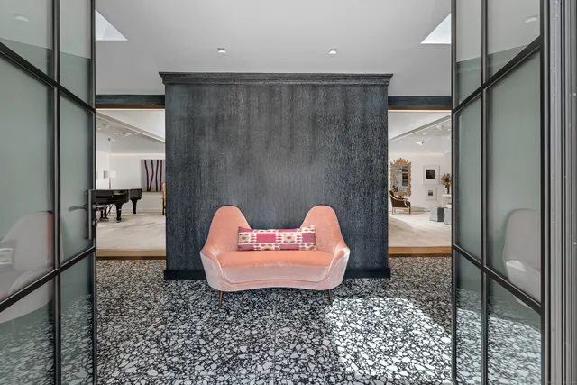 a living room with furniture and a rug