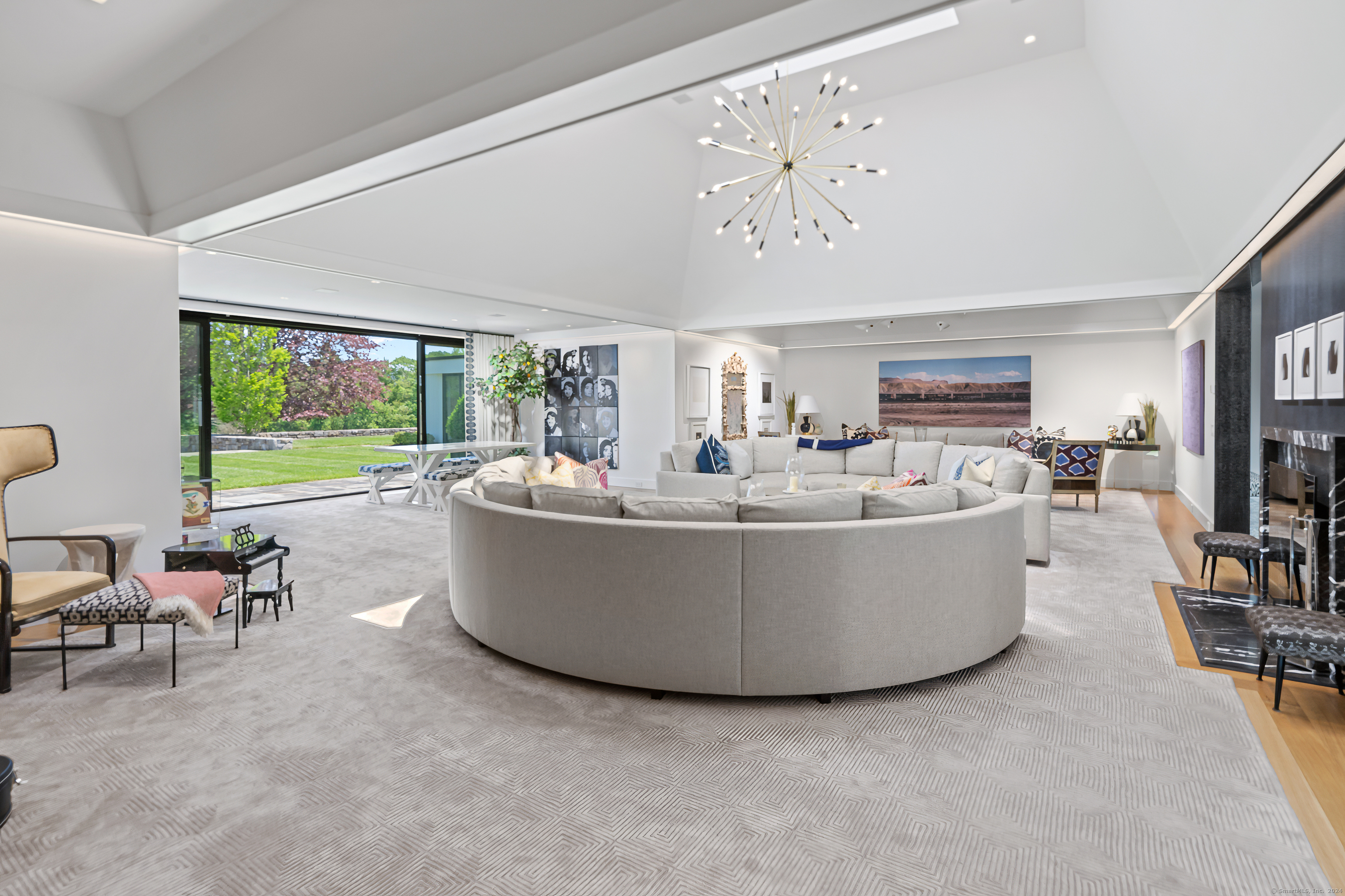 4900 Congress Street Fairfield, CT 06824 - Photo 7 of 40 a living room with furniture and a large window