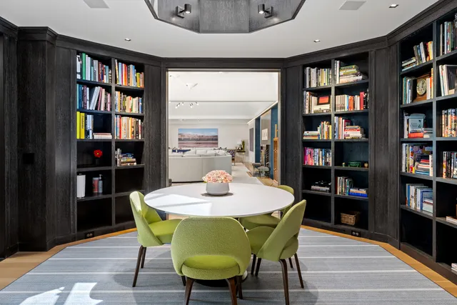 a dining room with furniture and wooden floor