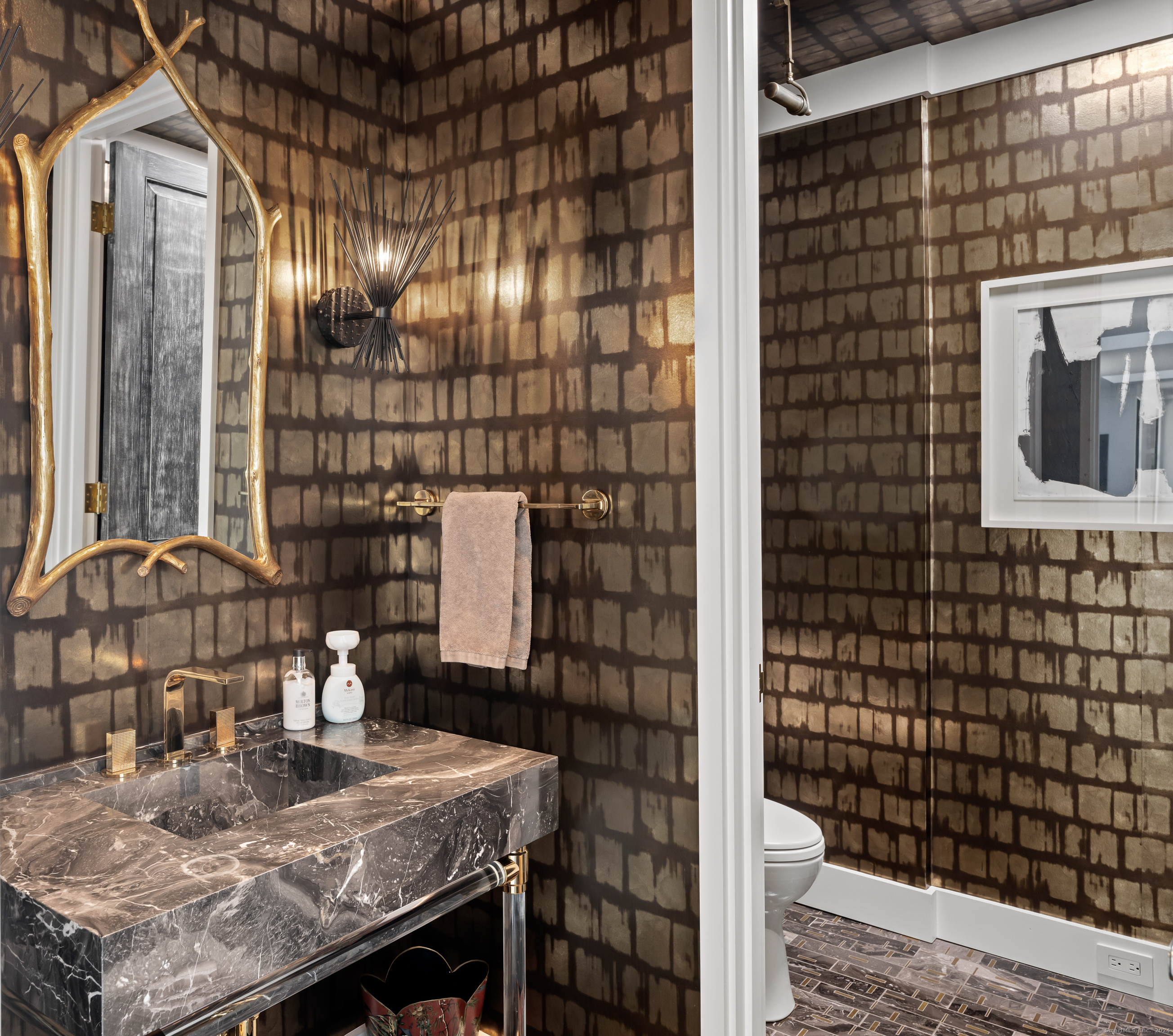 4900 Congress Street Fairfield, CT 06824 - Photo 10 of 40 a bathroom with a sink and a mirror