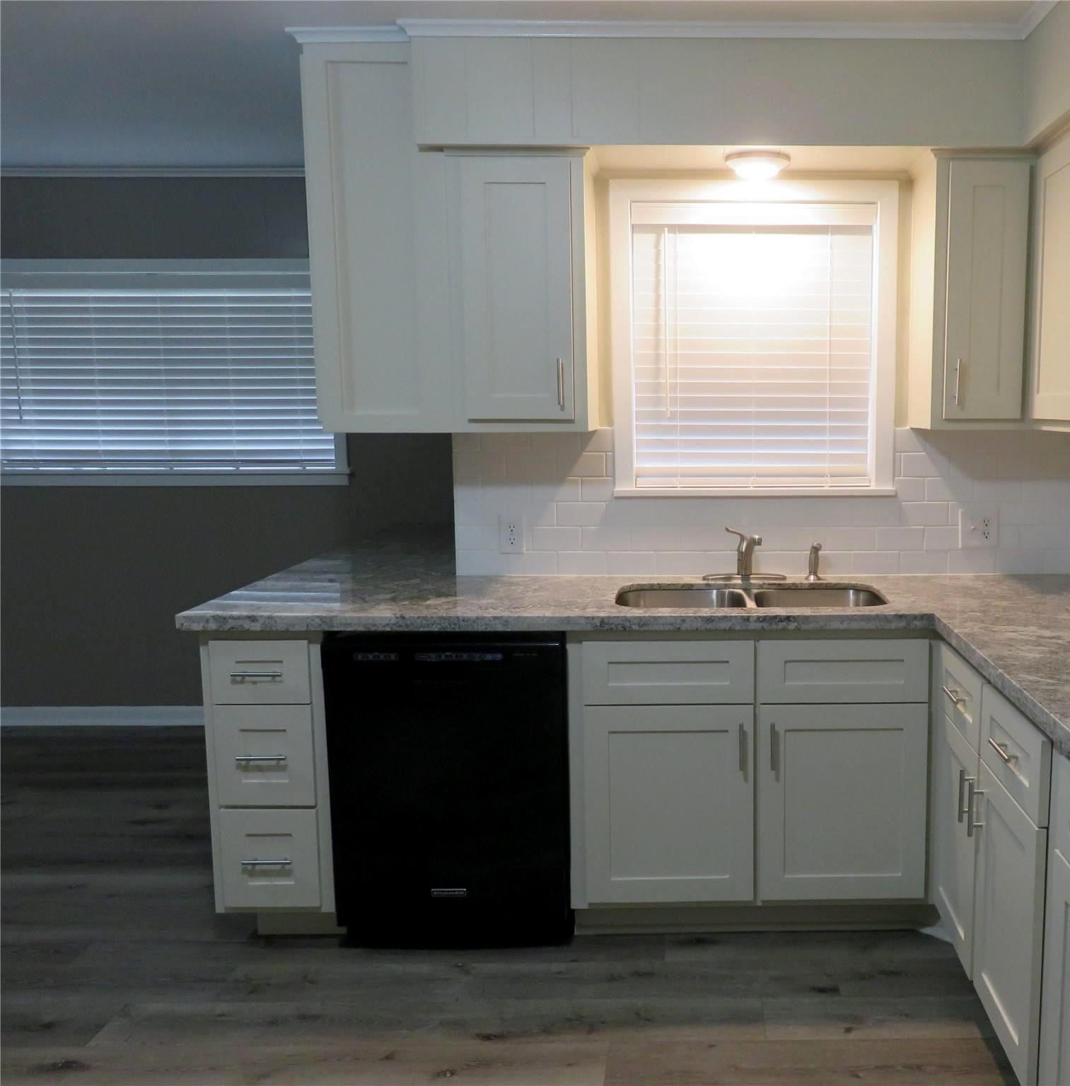 1519 Tobola Street Rosenberg, TX 77471 - Photo 16 of 31 There is lots of countertop room on both sides of the sink and dishwasher