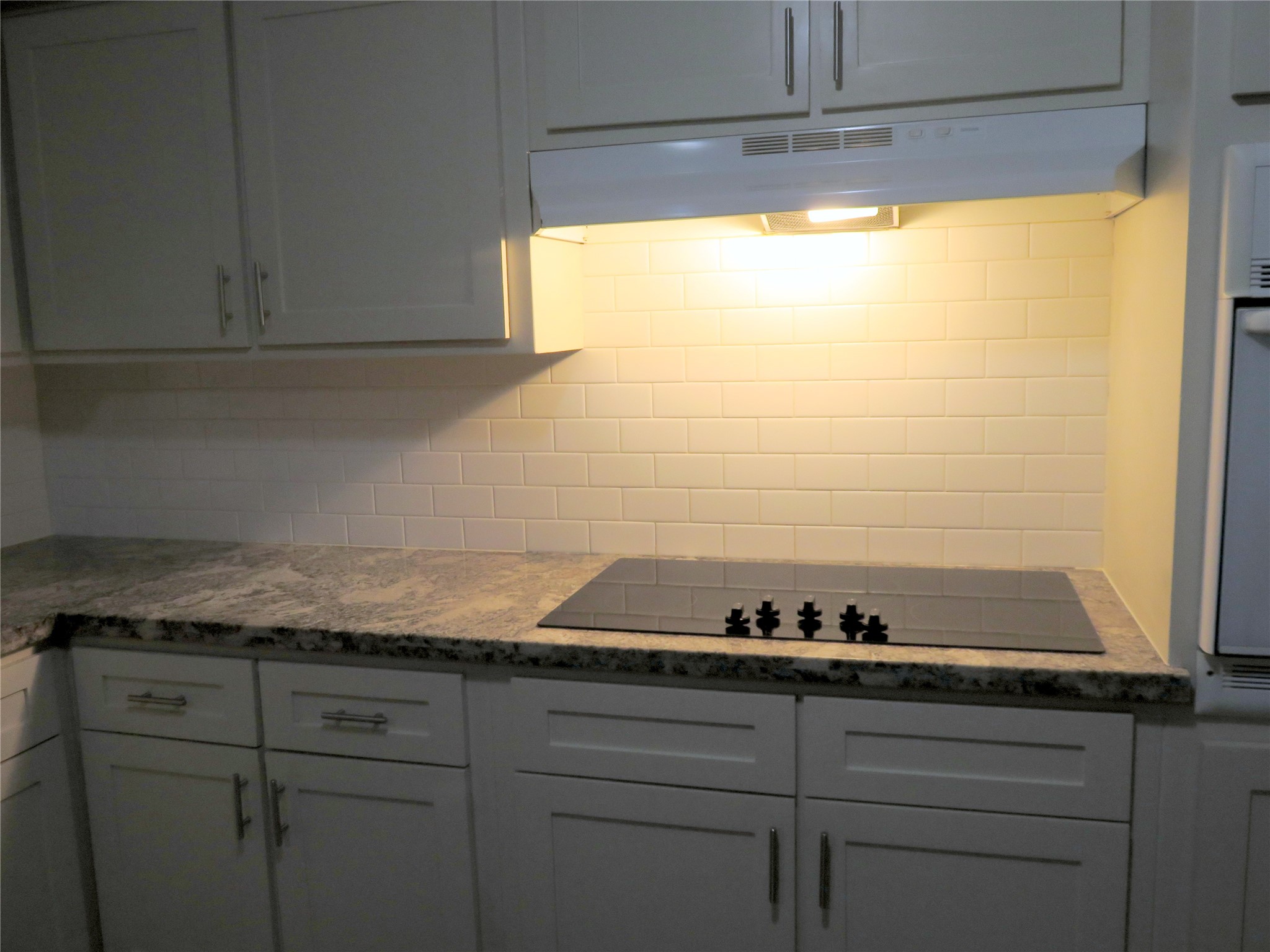 1519 Tobola Street Rosenberg, TX 77471 - Photo 17 of 31 Close up of the smooth top stove, with plenty of counter top room to the left of the stove
