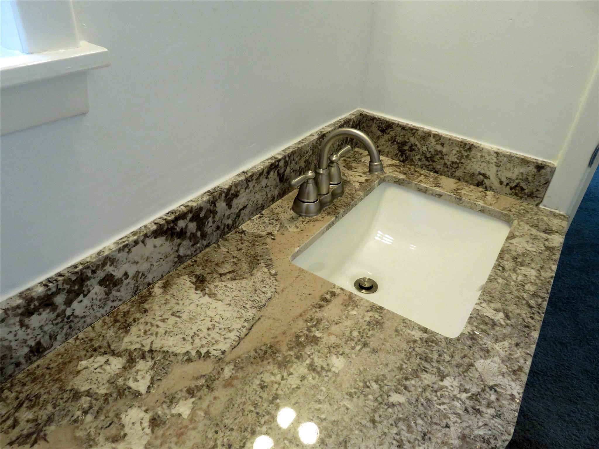 1519 Tobola Street Rosenberg, TX 77471 - Photo 26 of 31 Primary bathroom has been updated with beautiful granite counter top, updated undermount square sink, faucet & medicine cabinet interior repainted