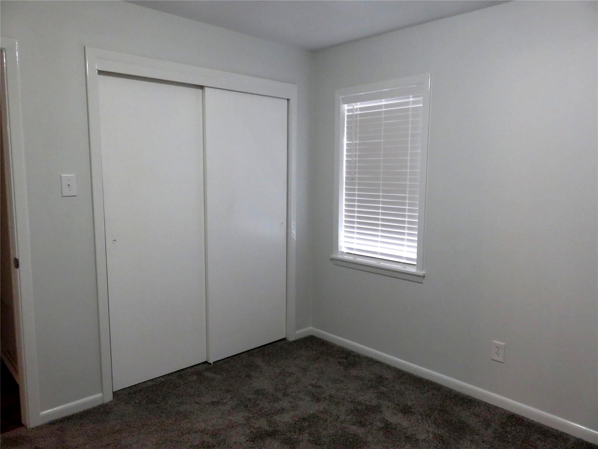 1519 Tobola Street Rosenberg, TX 77471 - Photo 27 of 31 The second bedroom is also roomy and has a large closet