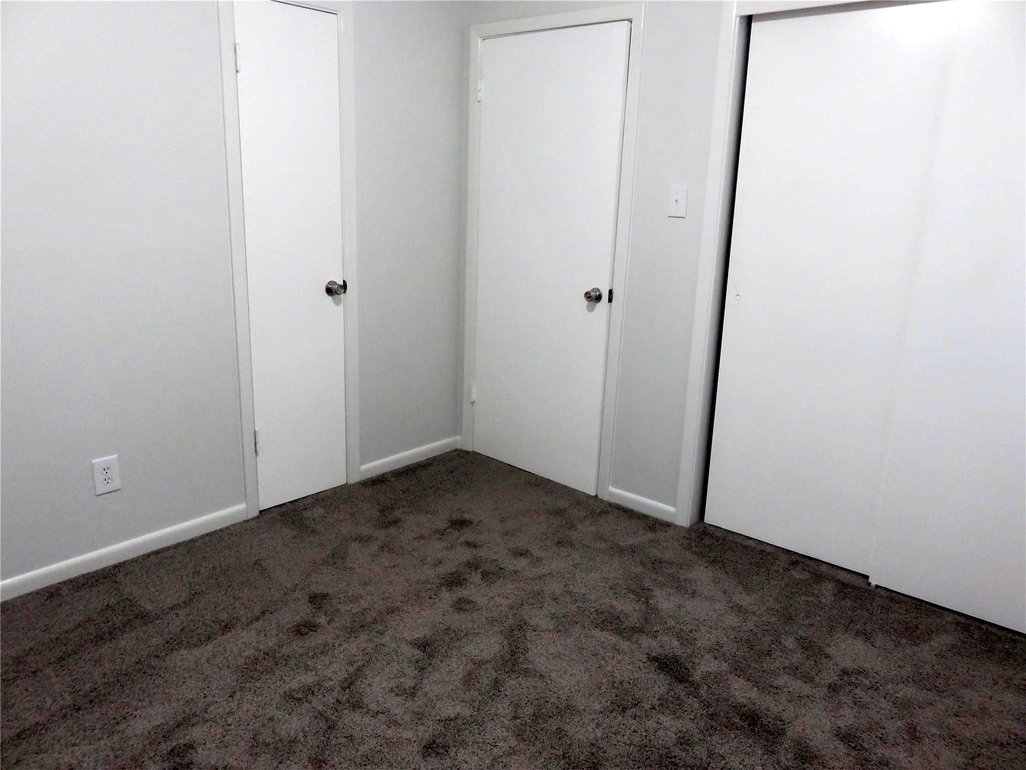 1519 Tobola Street Rosenberg, TX 77471 - Photo 28 of 31 Another view of the second bedroom showing it has the large, 2 sliding doors and the second closet to the left of the entry door