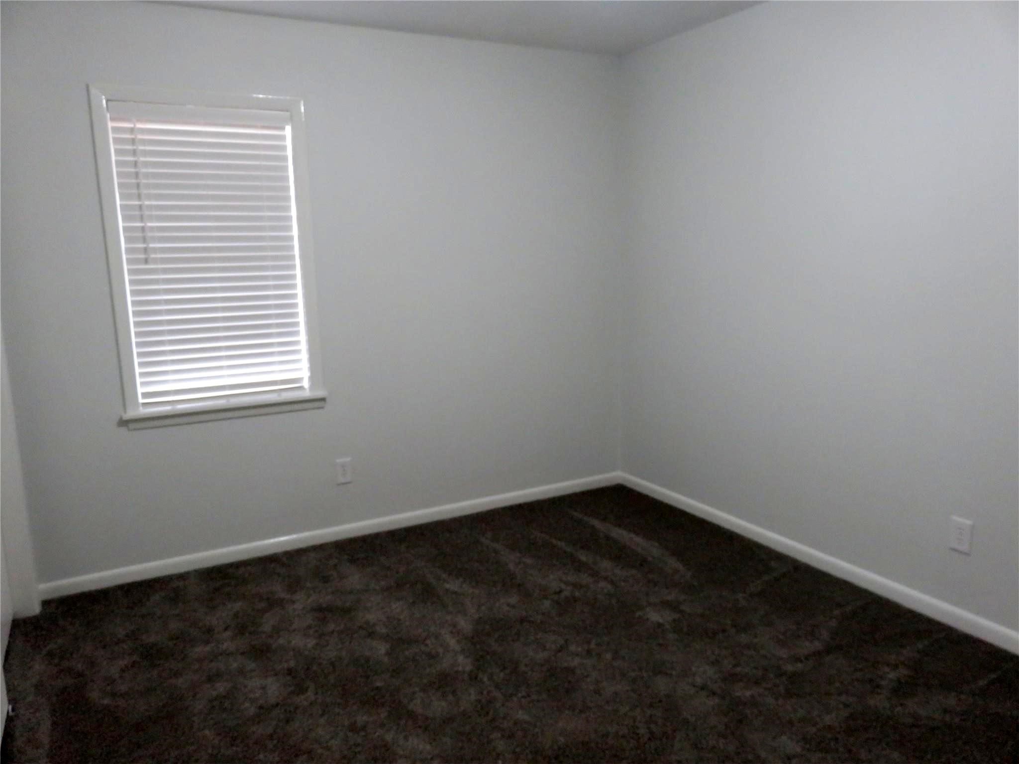 1519 Tobola Street Rosenberg, TX 77471 - Photo 30 of 31 The third bedroom is also roomy and has lots of natural lighting