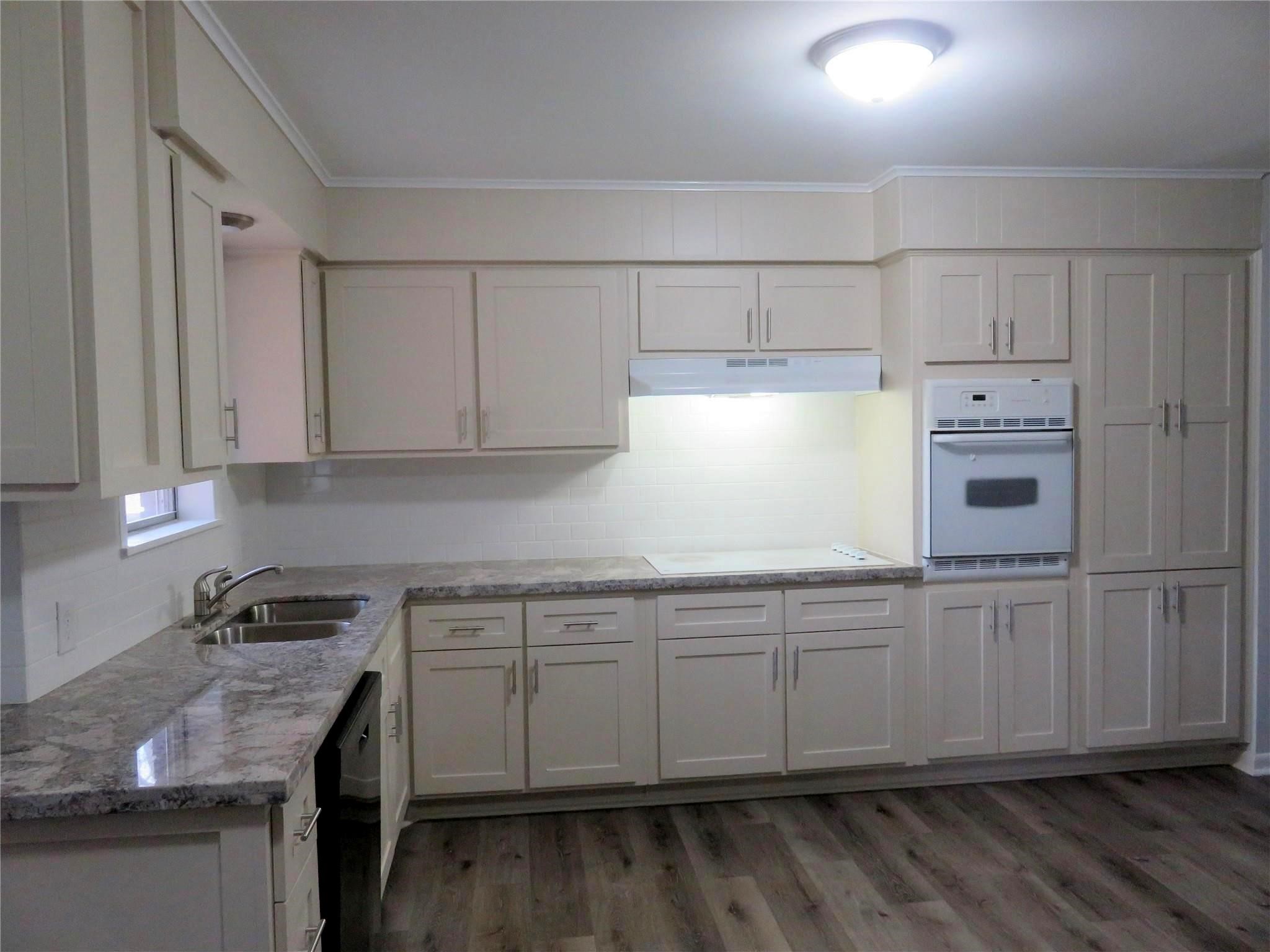 1519 Tobola Street Rosenberg, TX 77471 - Photo 7 of 31 The gorgeous granite counter tops wrap around the room and give you loads of counter top space!