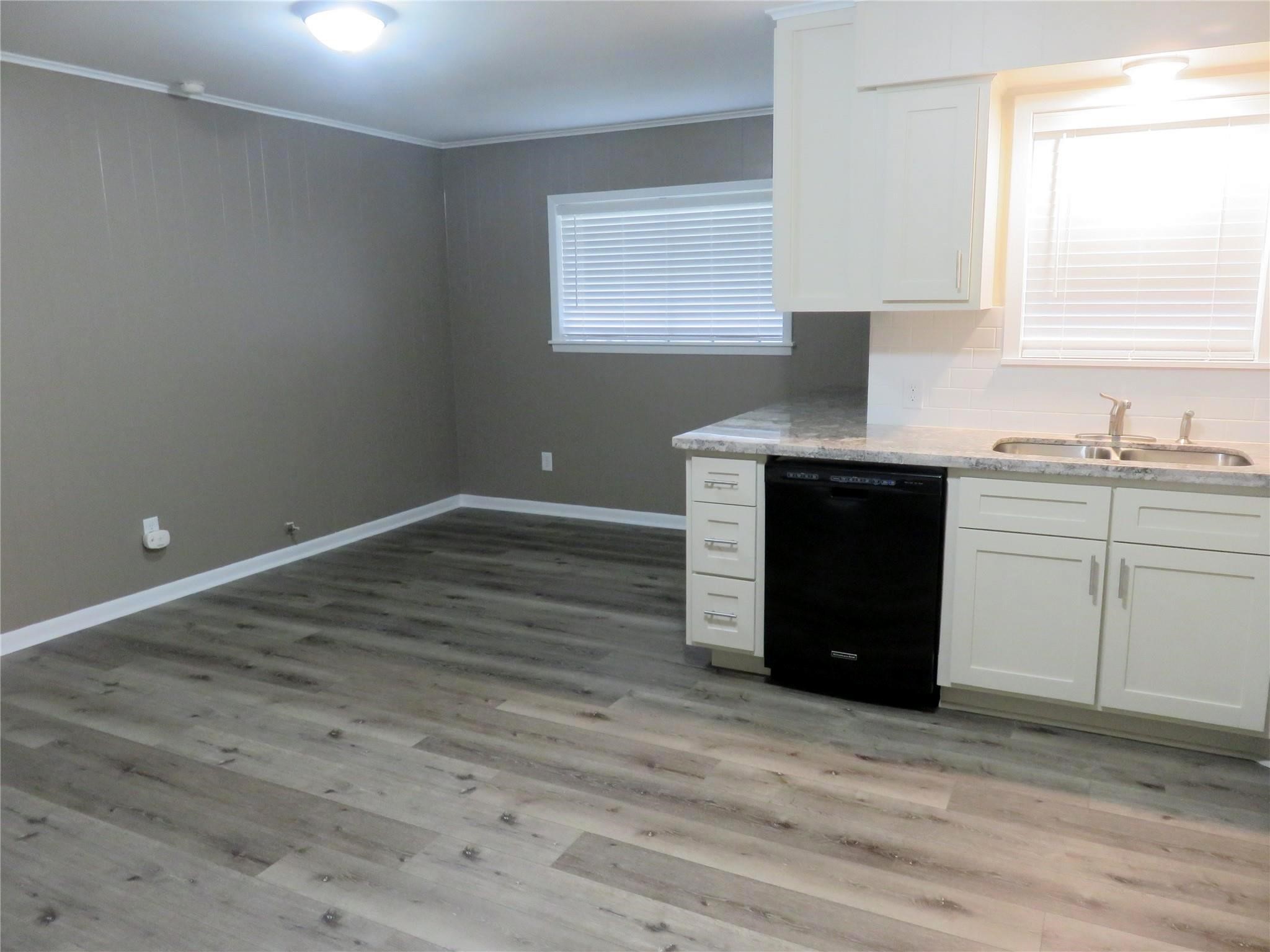 1519 Tobola Street Rosenberg, TX 77471 - Photo 10 of 31 The breakfast room is enormous, and full of light from the windows. The laminate flooring makes clean up a breeze, and plenty of room for dining room furniture.