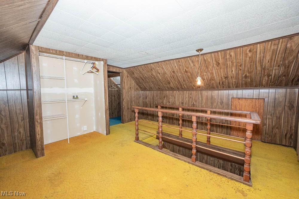 103 Valley Road Damascus, OH 44619 - Photo 21 of 27 Bonus room featuring wood ceiling, wooden walls, and lofted ceiling