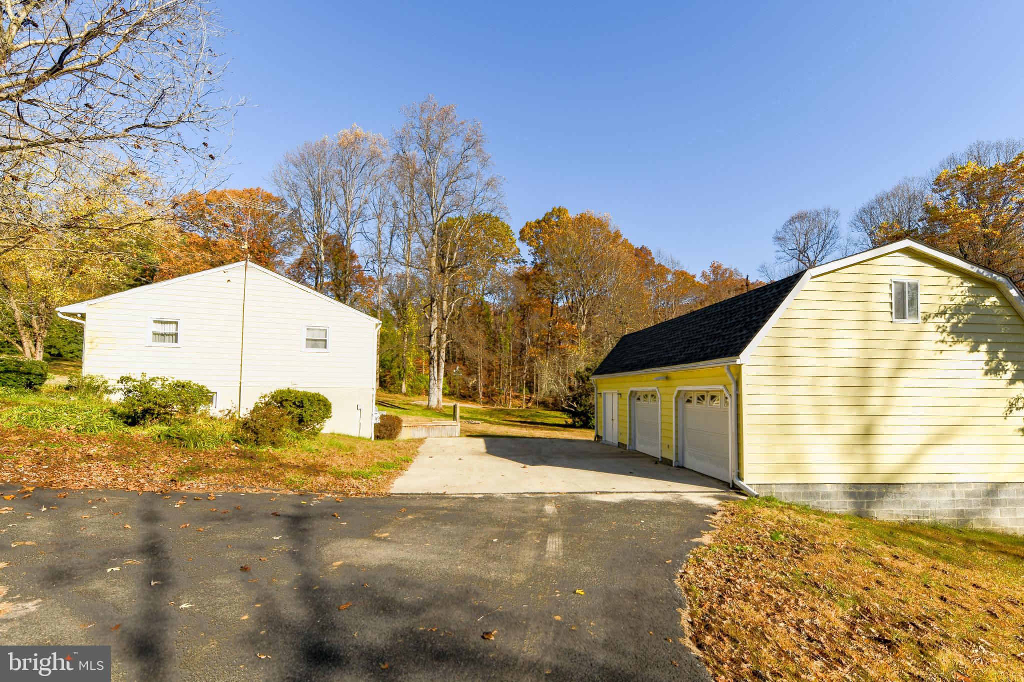 5611 Stephen Reid Road Huntingtown, MD 20639 - Photo 3 of 35 Side of Home and 2 Car Garage
