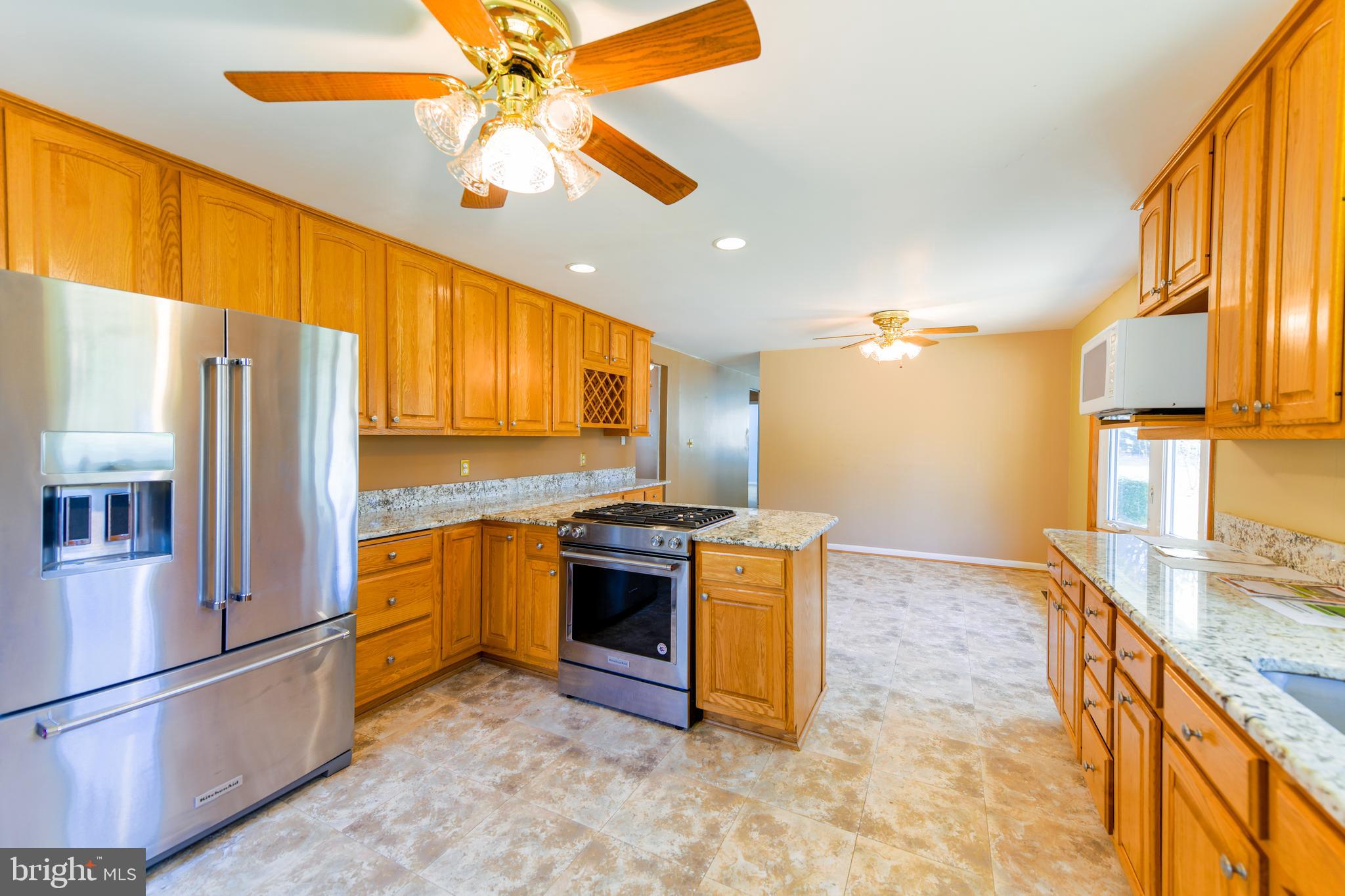 5611 Stephen Reid Road Huntingtown, MD 20639 - Photo 8 of 35 Gas Stove, Kitchen Aid Refrigerator