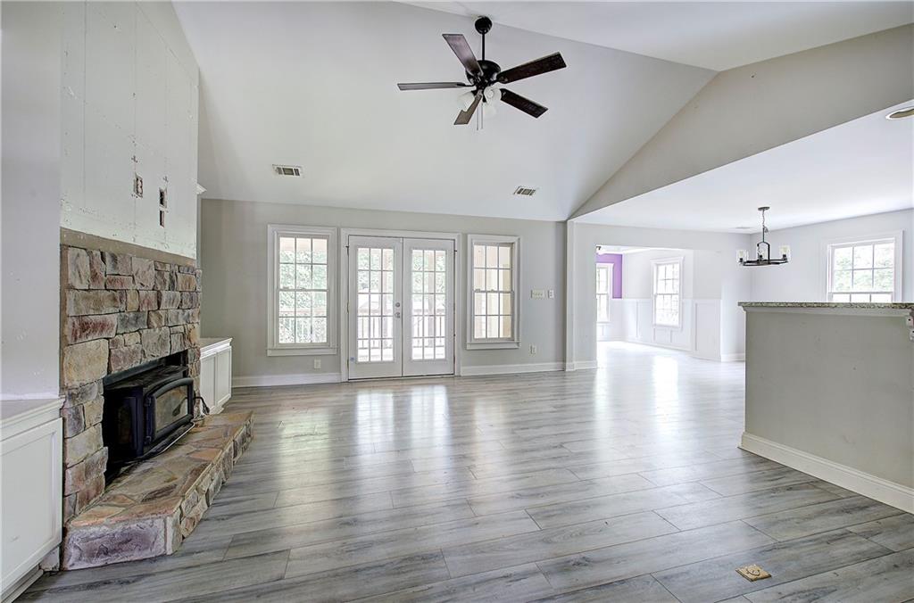 561 Holland Road Dallas, GA 30157 - Photo 5 of 48 a view of an empty room with window and wooden floor