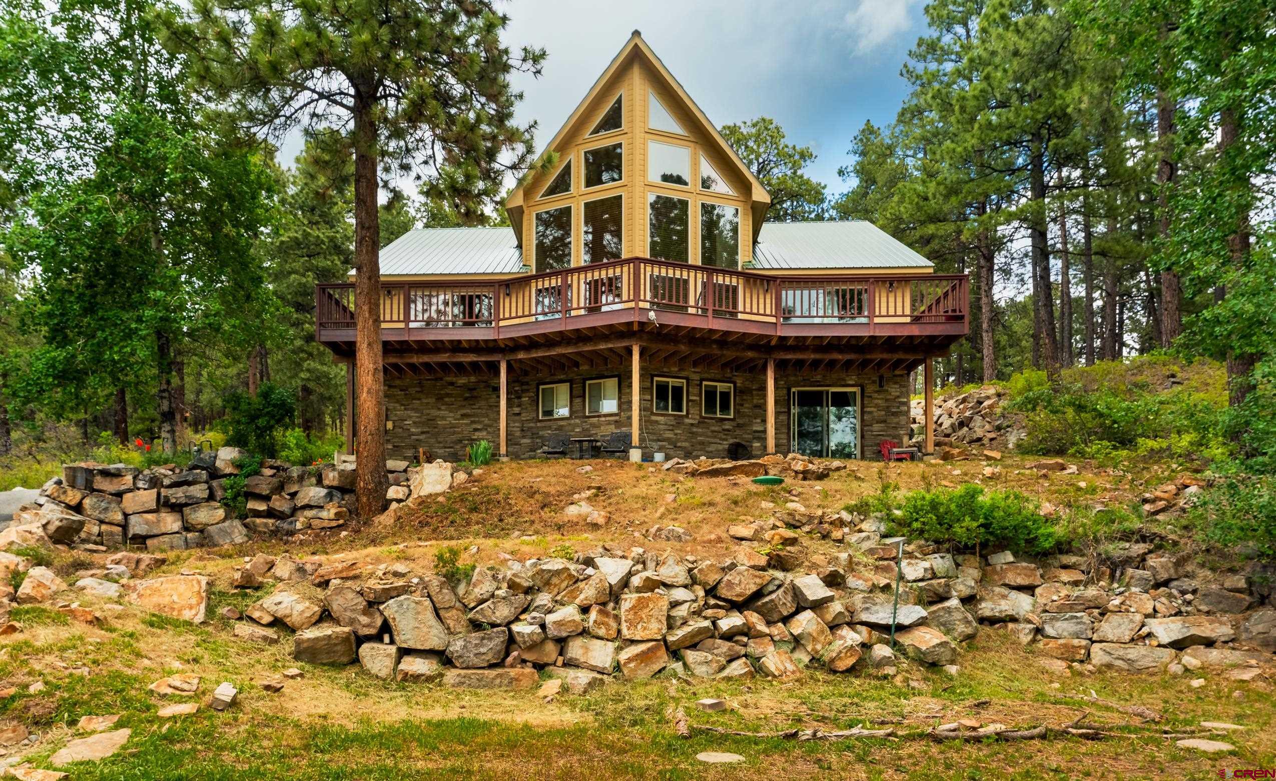 197 Buckhorn Road Bayfield, CO 81122 - Photo 31 of 34 a front view of a house with a garden