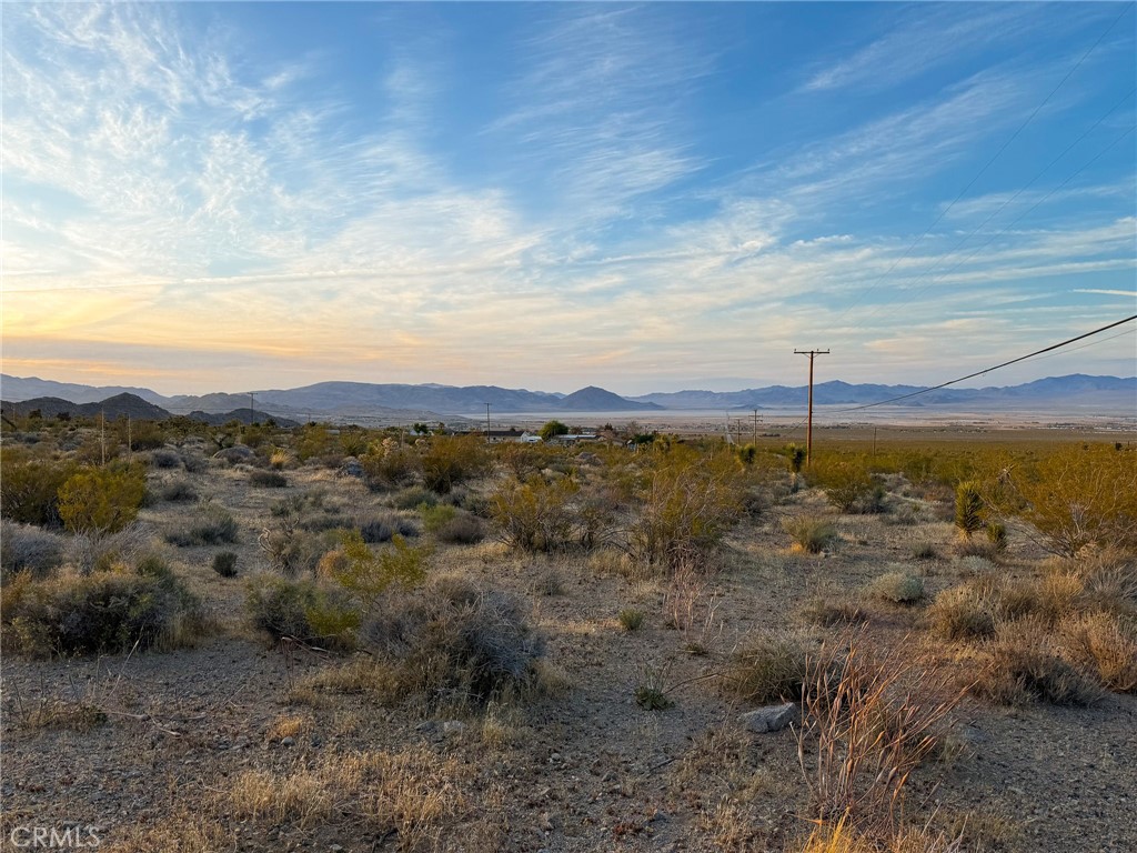 7980 Crystal Creek Road Lucerne Valley, CA 92356 - Photo 2 of 9 a view of a town with mountains in the background