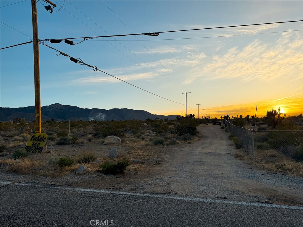 7980 Crystal Creek Road Lucerne Valley, CA 92356 - Photo 7 of 9 a view of a road in front of a house