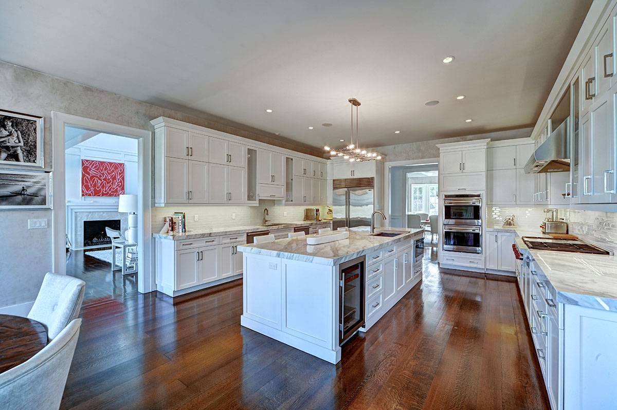 63 Newlight Lane Bridgehampton, NY 11976 - Photo 10 of 37 a large kitchen with stainless steel appliances granite countertop a stove oven and a refrigerator