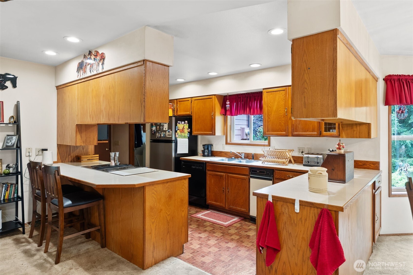 1142 SR 6 Raymond, WA 98577 - Photo 12 of 40 a kitchen that has a lot of cabinets a sink and a stove in it