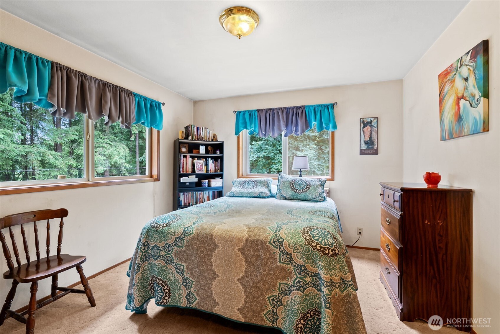 1142 SR 6 Raymond, WA 98577 - Photo 20 of 40 a bedroom with a bed and a bookshelf