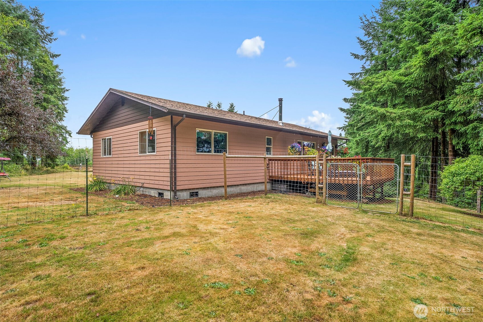 1142 SR 6 Raymond, WA 98577 - Photo 23 of 40 a backyard of a house with table and chairs
