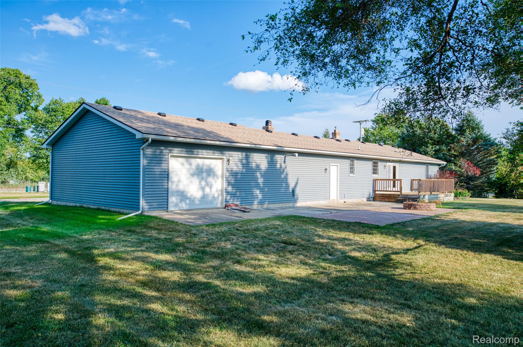 1188 South Maxfield Road Brighton, MI 48114 - Photo 21 of 24 rear of home with drive through garage bay