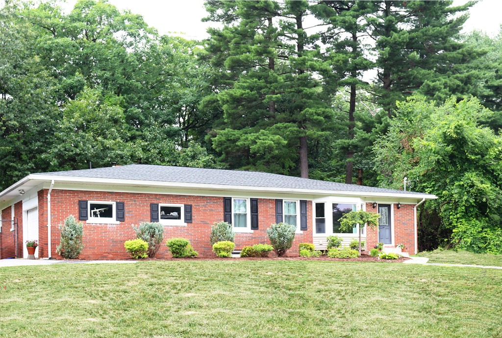 92 Ellendale Circle Springfield, MA 01128 - Photo 1 of 25 a front view of house with yard outdoor seating and green space