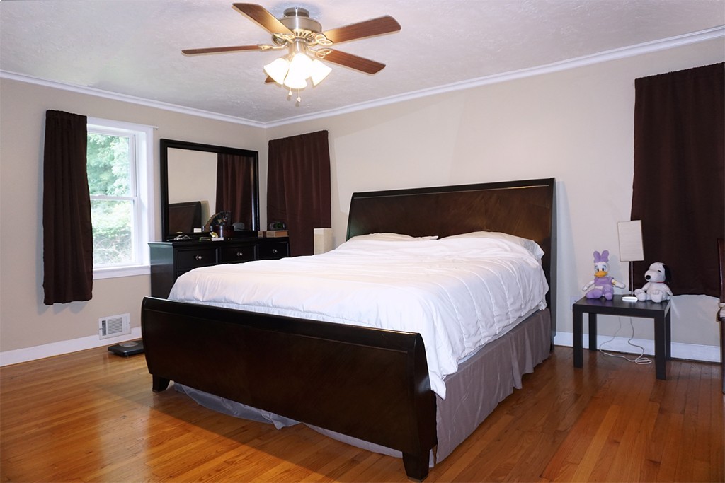 92 Ellendale Circle Springfield, MA 01128 - Photo 14 of 25 a bed room with a bed and a chair