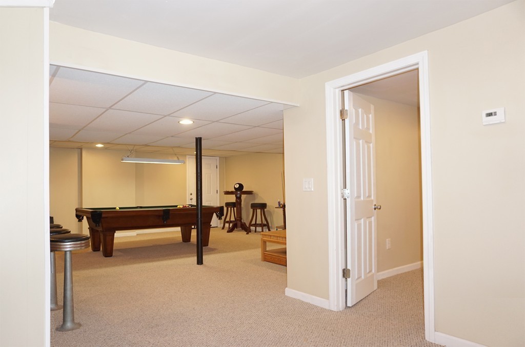 92 Ellendale Circle Springfield, MA 01128 - Photo 16 of 25 a view of a lobby with furniture and a table