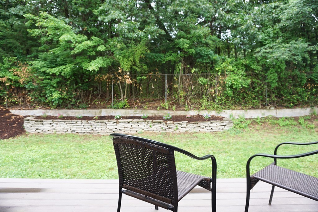 92 Ellendale Circle Springfield, MA 01128 - Photo 24 of 25 a backyard of a house with table and chairs