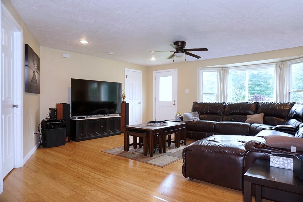92 Ellendale Circle Springfield, MA 01128 - Photo 5 of 25 a living room with furniture and a flat screen tv