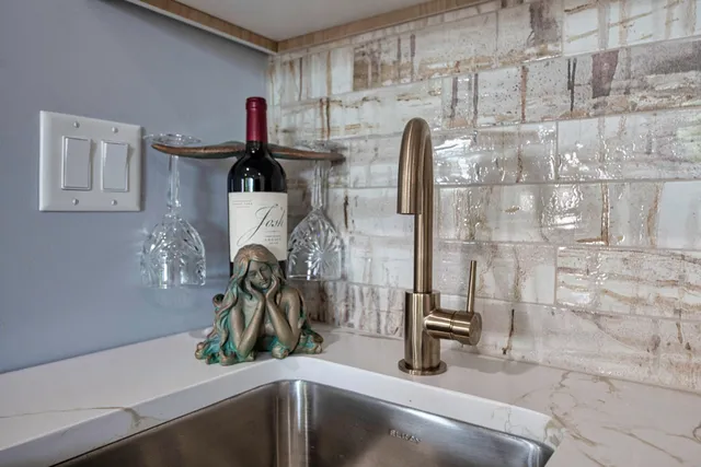 a kitchen with a sink and a refrigerator