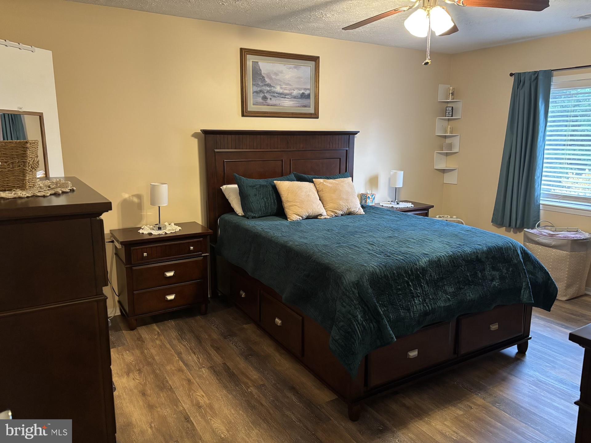 4220 Crystal Court, Unit 3D Hampstead, MD 21074 - Photo 14 of 16 a bedroom with a bed and a chandelier