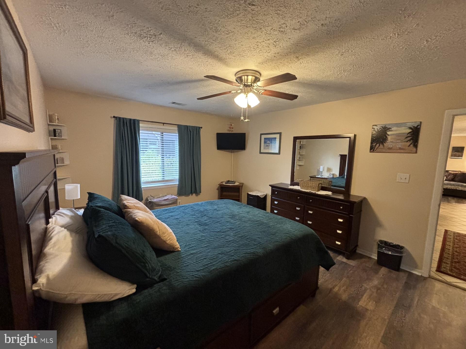 4220 Crystal Court, Unit 3D Hampstead, MD 21074 - Photo 15 of 16 a bedroom with a bed and a flat screen tv