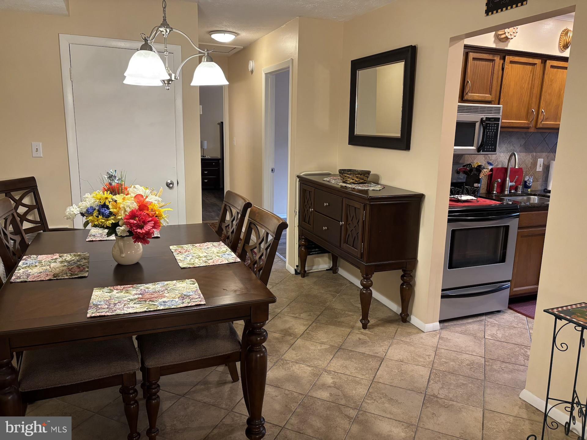 4220 Crystal Court, Unit 3D Hampstead, MD 21074 - Photo 7 of 16 a view of a dining room with furniture