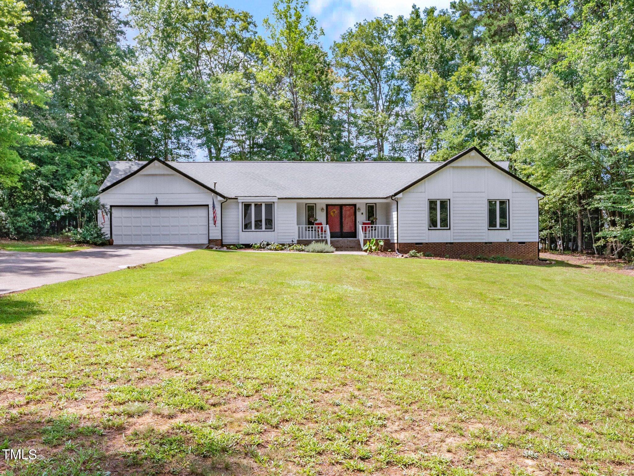 512 Brittany Bay West Raleigh, NC 27614 - Photo 1 of 27 a house view with a garden space