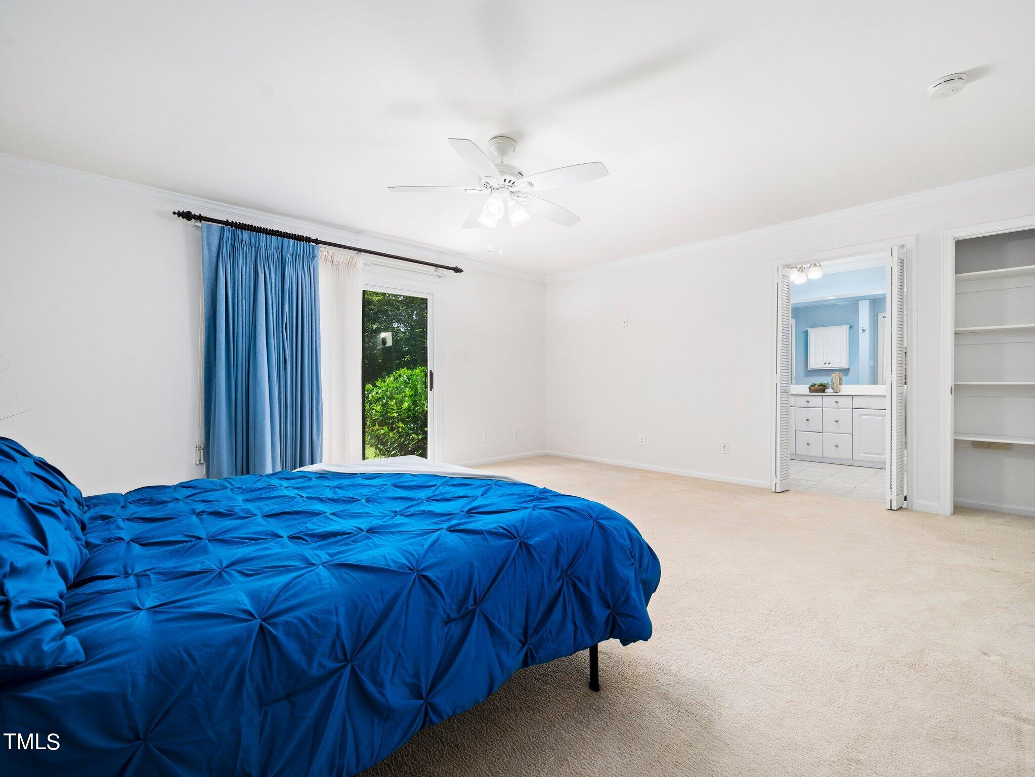 512 Brittany Bay West Raleigh, NC 27614 - Photo 13 of 27 a bedroom with a bed and a painting on the wall