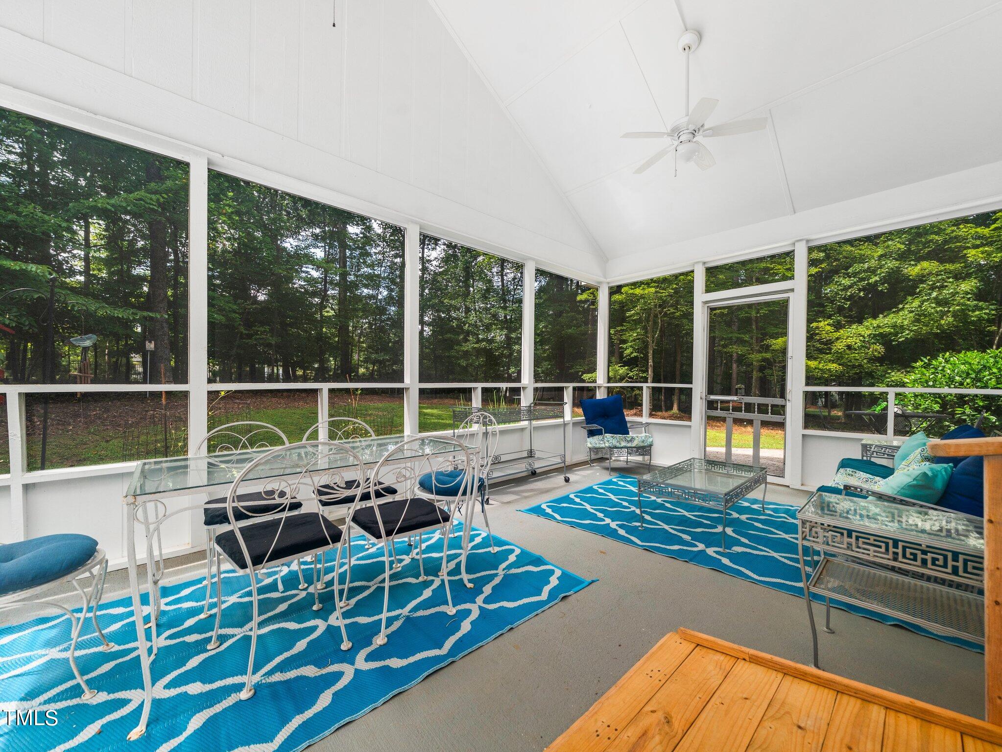 512 Brittany Bay West Raleigh, NC 27614 - Photo 19 of 27 a view of a living room and floor to ceiling window or wooden floor