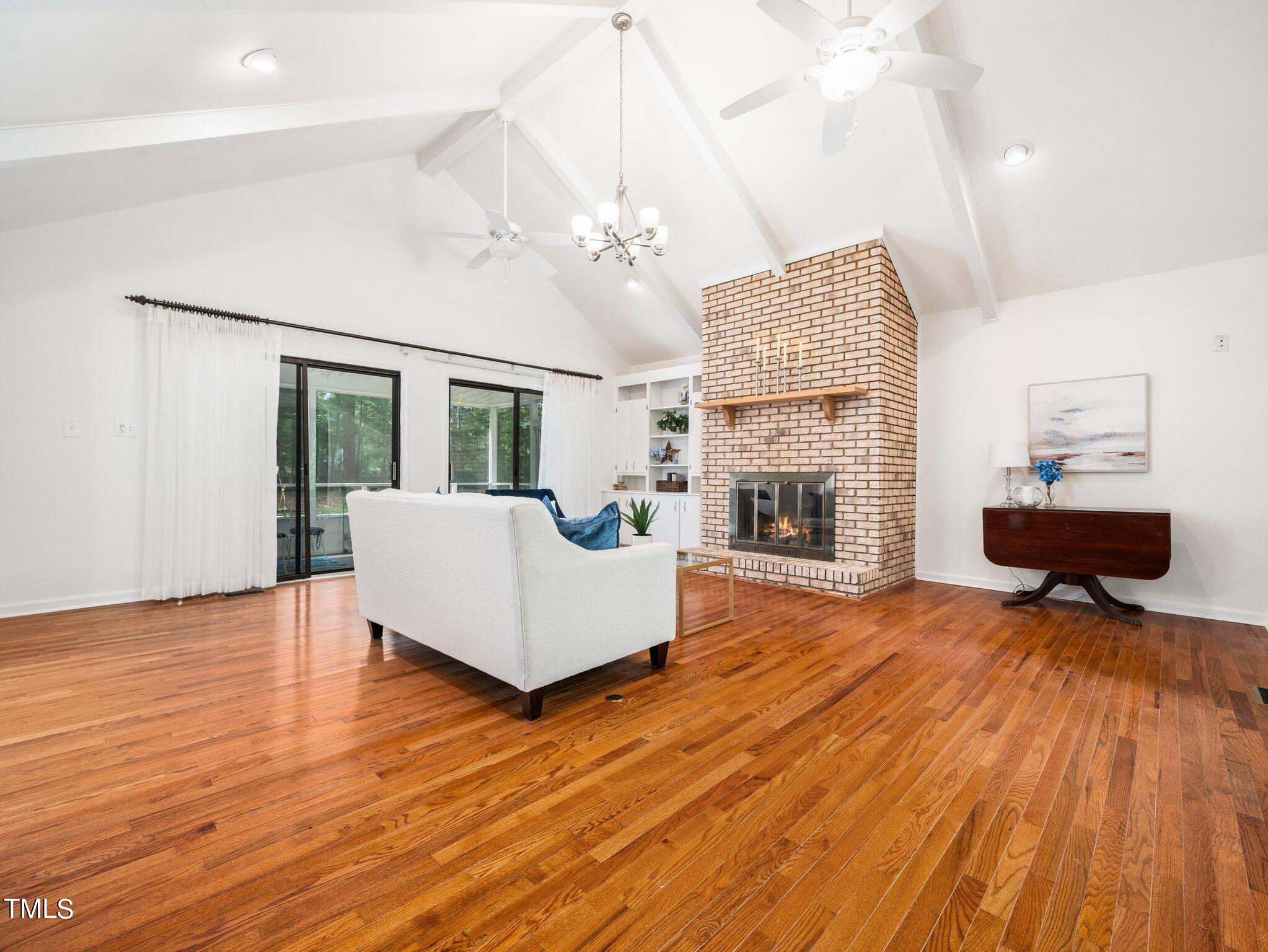 512 Brittany Bay West Raleigh, NC 27614 - Photo 7 of 27 a living room with furniture and a fireplace