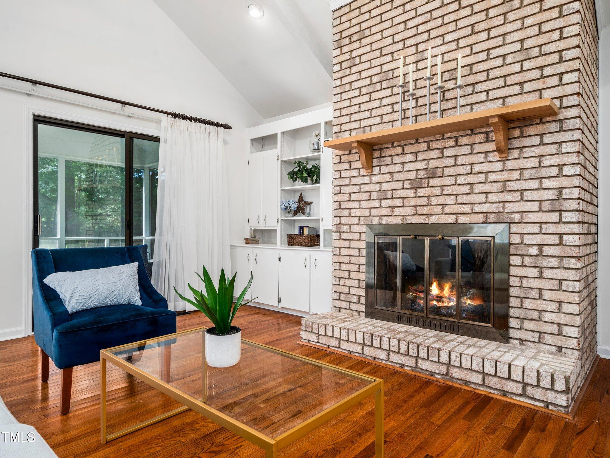 512 Brittany Bay West Raleigh, NC 27614 - Photo 8 of 27 a living room with furniture and a fireplace