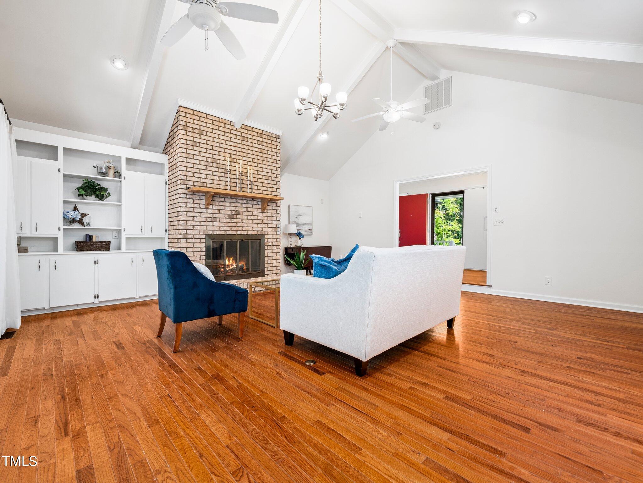 512 Brittany Bay West Raleigh, NC 27614 - Photo 9 of 27 a living room with furniture and a fireplace