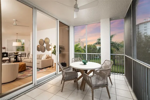 a view of a dining room and furniture wooden floor and a floor to ceiling window