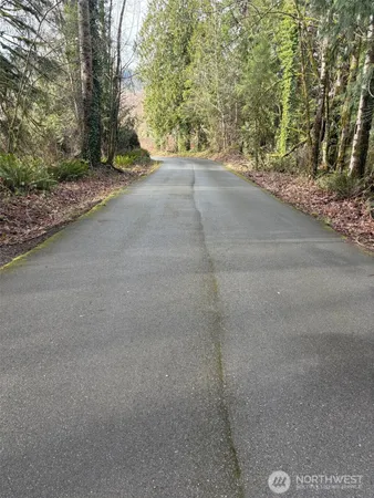 a view of a road with a yard