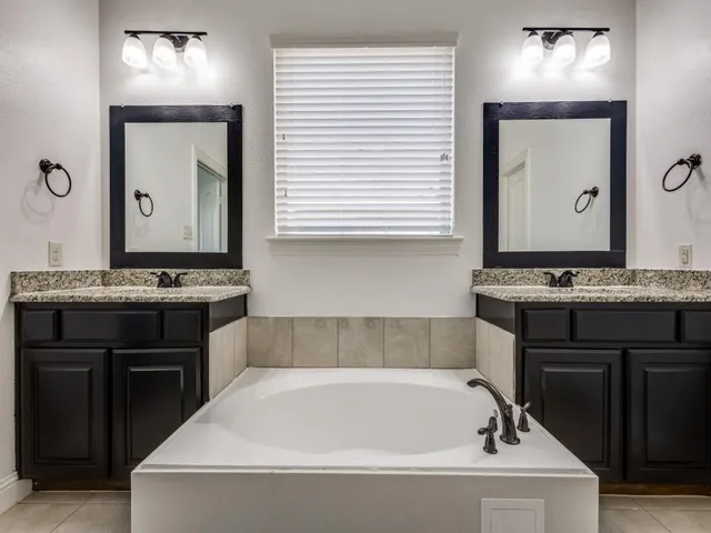 a bathroom with a bathtub and a sink
