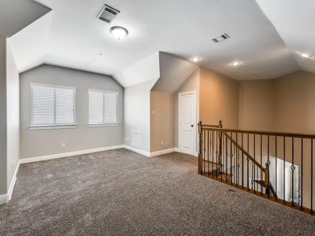 a view of an empty room and a window