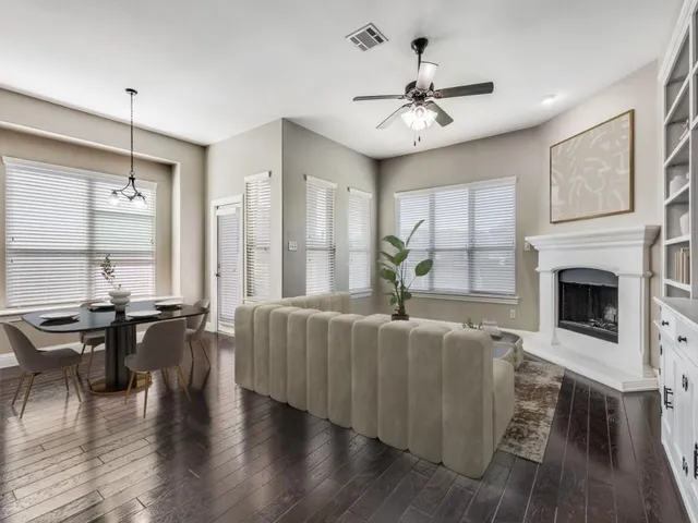 a living room with furniture fireplace and window