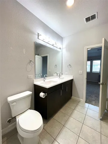 a bathroom with a shower and a sink